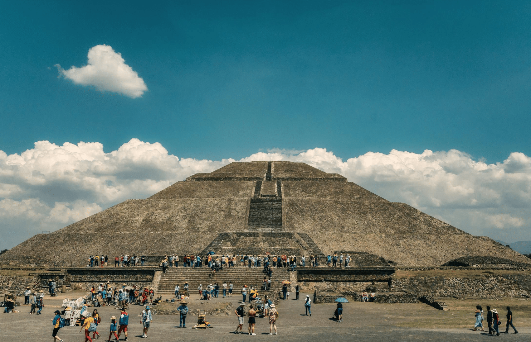 Tourists visiting the Pyramid of the Sun at Teotihuacan. Teotihuacan Basilica Guadalupe Tour