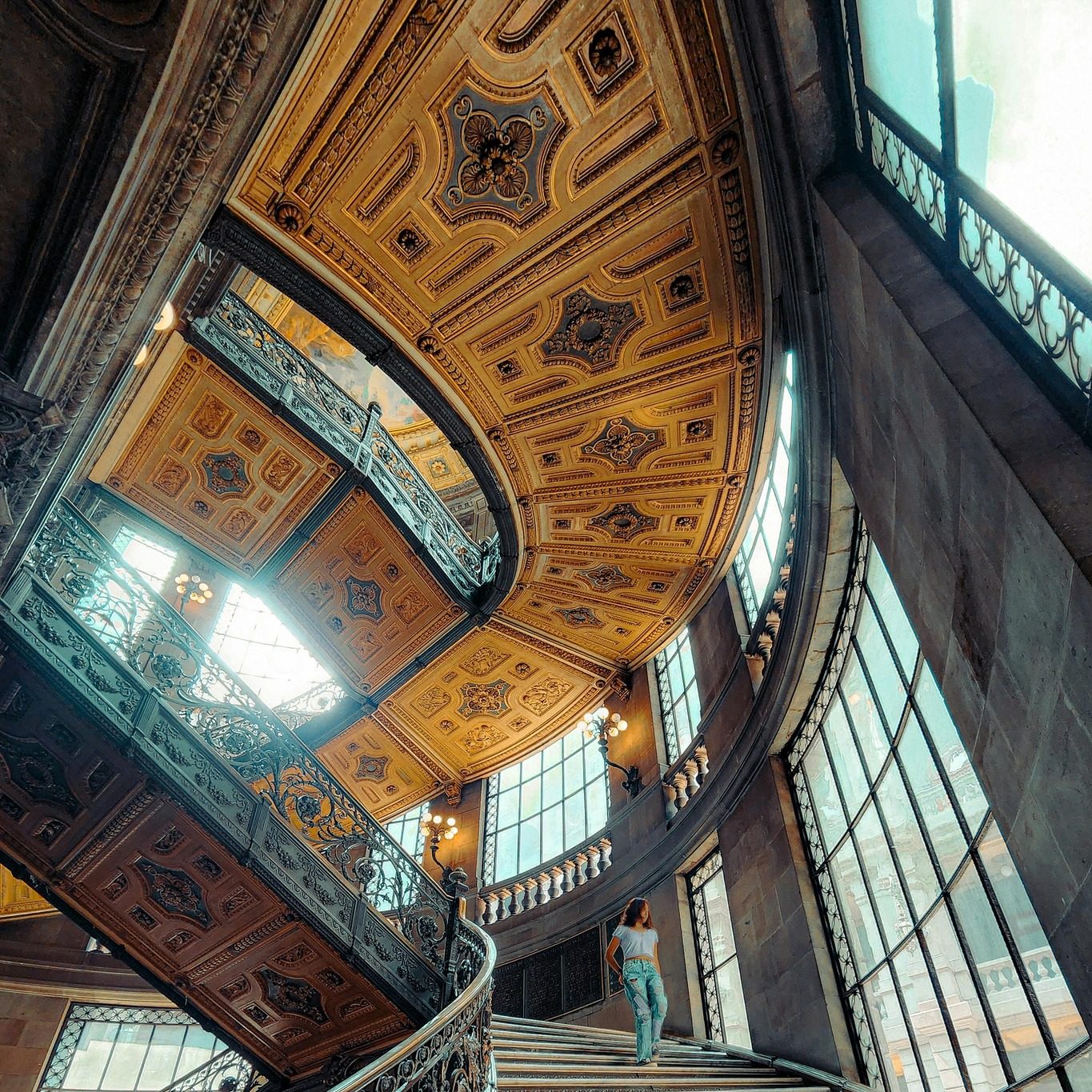 Woman exploring an ornate historic building in Mexico City on a guided cultural tour